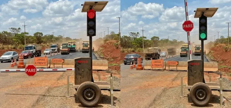 Semáforo móvel com a cancela baixada e a placa PARE em evidência